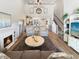 Living area with high ceilings, fireplace and view into kitchen at 220 Machrie Loop # A, Myrtle Beach, SC 29588