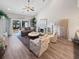 Spacious living room with vaulted ceiling, fireplace, and view of pool at 220 Machrie Loop # A, Myrtle Beach, SC 29588