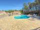 Community pool with brick patio and seating at 220 Machrie Loop # A, Myrtle Beach, SC 29588