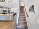 Staircase with wood railings, leading to upper level and kitchen at 220 Machrie Loop # A, Myrtle Beach, SC 29588