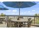 Ocean view patio dining with tables, chairs, and umbrellas at 2311 South Ocean Blvd. # 1164, Myrtle Beach, SC 29577