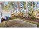 Small backyard with concrete patio and wooded backdrop at 324 Golan Circle # B, Myrtle Beach, SC 29579