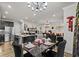 Open dining area with a black table and kitchen views at 324 Golan Circle # B, Myrtle Beach, SC 29579