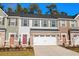 Two story townhome with neutral siding and a two car garage at 324 Golan Circle # B, Myrtle Beach, SC 29579