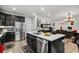 Modern kitchen with white quartz countertops and stainless steel appliances at 324 Golan Circle # B, Myrtle Beach, SC 29579