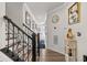 Elegant staircase with black iron railing and hardwood flooring at 324 Golan Circle # B, Myrtle Beach, SC 29579