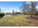 Spacious backyard with trees and pergola at 417 San Benito Ct., Longs, SC 29568