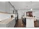 Gray kitchen cabinets, granite counters and stainless steel appliances at 417 San Benito Ct., Longs, SC 29568