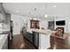 Large kitchen island with granite countertops and ample cabinet space at 417 San Benito Ct., Longs, SC 29568