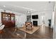 Spacious living room with hardwood floors and fireplace at 417 San Benito Ct., Longs, SC 29568