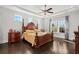 Large main bedroom with hardwood floors and a king-size bed at 417 San Benito Ct., Longs, SC 29568