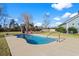 Relaxing kidney-shaped pool with concrete decking at 417 San Benito Ct., Longs, SC 29568