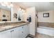 Bathroom with double vanity and granite countertop at 501 S Ocean Blvd. # 304, North Myrtle Beach, SC 29582