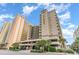 Oceanfront building with parking and tropical landscaping at 501 S Ocean Blvd. # 304, North Myrtle Beach, SC 29582