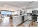 Modern white kitchen with stainless steel appliances and ocean view at 501 S Ocean Blvd. # 304, North Myrtle Beach, SC 29582