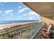 Balcony with outdoor seating offering breathtaking ocean views at 501 S Ocean Blvd. # 304, North Myrtle Beach, SC 29582
