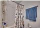 Bathroom with tub and shower, plus a seashell-themed curtain at 575 Mossbank Loop, Longs, SC 29568