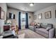Bedroom with a daybed, workspace, and large window at 575 Mossbank Loop, Longs, SC 29568