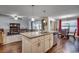 Open concept kitchen with island and seating area at 575 Mossbank Loop, Longs, SC 29568