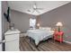 Cozy bedroom with a ceiling fan and coral nightstand at 612 River Oaks Dr. # 55-C, Myrtle Beach, SC 29579