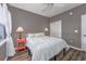 Charming bedroom with two coral nightstands and ceiling fan at 612 River Oaks Dr. # 55-C, Myrtle Beach, SC 29579