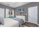 Comfortable bedroom with dresser, TV mount, and sliding door access at 612 River Oaks Dr. # 55-C, Myrtle Beach, SC 29579