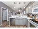 Open concept kitchen with island, stainless steel appliances, and view to living room at 612 River Oaks Dr. # 55-C, Myrtle Beach, SC 29579