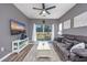 Spacious living room with hardwood floors, comfy seating, and sliding glass doors leading to a patio at 612 River Oaks Dr. # 55-C, Myrtle Beach, SC 29579