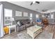 Open living room with hardwood floors, comfortable seating and views into the kitchen and dining areas at 612 River Oaks Dr. # 55-C, Myrtle Beach, SC 29579