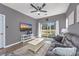 Relaxing living room with hardwood floors, comfortable sofa, and sliding glass doors at 612 River Oaks Dr. # 55-C, Myrtle Beach, SC 29579