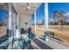 Enjoy this screened porch with seating area and golf course view at 612 River Oaks Dr. # 55-C, Myrtle Beach, SC 29579