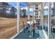 Spacious screened patio with table and chairs, perfect for outdoor dining at 612 River Oaks Dr. # 55-C, Myrtle Beach, SC 29579