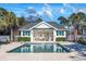 Community pool with a pool house and ample space for relaxation at 612 River Oaks Dr. # 55-C, Myrtle Beach, SC 29579
