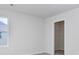 A bedroom with neutral walls and carpet plus a closet and large window at 808 St. Albans Loop, Conway, SC 29526