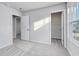 A bedroom with 2 doors, neutral walls, carpet, and a window at 808 St. Albans Loop, Conway, SC 29526