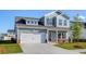 Charming two-story home with a two-car garage and manicured lawn, perfect for families at 808 St. Albans Loop, Conway, SC 29526