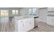 Kitchen with stainless steel dishwasher, granite countertops, white cabinets and sink at 808 St. Albans Loop, Conway, SC 29526