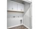 Spacious laundry room with white cabinets and wood look flooring at 808 St. Albans Loop, Conway, SC 29526