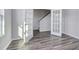 Another view of the office with French doors, gray floors, and plenty of natural light at 808 St. Albans Loop, Conway, SC 29526