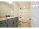 Bathroom with a single vanity, bathtub, and tiled floors at 8091 Laurel Ash Ave., Myrtle Beach, SC 29572