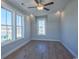 Spacious bedroom with hardwood floors and multiple windows at 8091 Laurel Ash Ave., Myrtle Beach, SC 29572