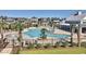 Resort-style pool with surrounding lounge chairs and clubhouse at 8091 Laurel Ash Ave., Myrtle Beach, SC 29572