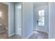 Bright entryway with view into adjacent bathroom and laundry room at 8091 Laurel Ash Ave., Myrtle Beach, SC 29572