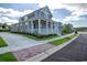 Gray two-story home with white porch and landscaping at 8091 Laurel Ash Ave., Myrtle Beach, SC 29572