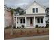 Beige two-story home with front porch at 8091 Laurel Ash Ave., Myrtle Beach, SC 29572