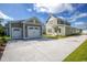 Two-car garage and craftsman style home with large driveway at 8091 Laurel Ash Ave., Myrtle Beach, SC 29572