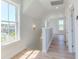 Upstairs hallway with hardwood floors and natural light at 8091 Laurel Ash Ave., Myrtle Beach, SC 29572