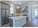Modern kitchen with island, stainless steel appliances, and hardwood floors at 8091 Laurel Ash Ave., Myrtle Beach, SC 29572