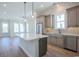 Modern kitchen with gray cabinets and white quartz countertops at 8091 Laurel Ash Ave., Myrtle Beach, SC 29572