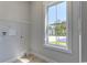 Laundry room with built-in shelving and window at 8091 Laurel Ash Ave., Myrtle Beach, SC 29572